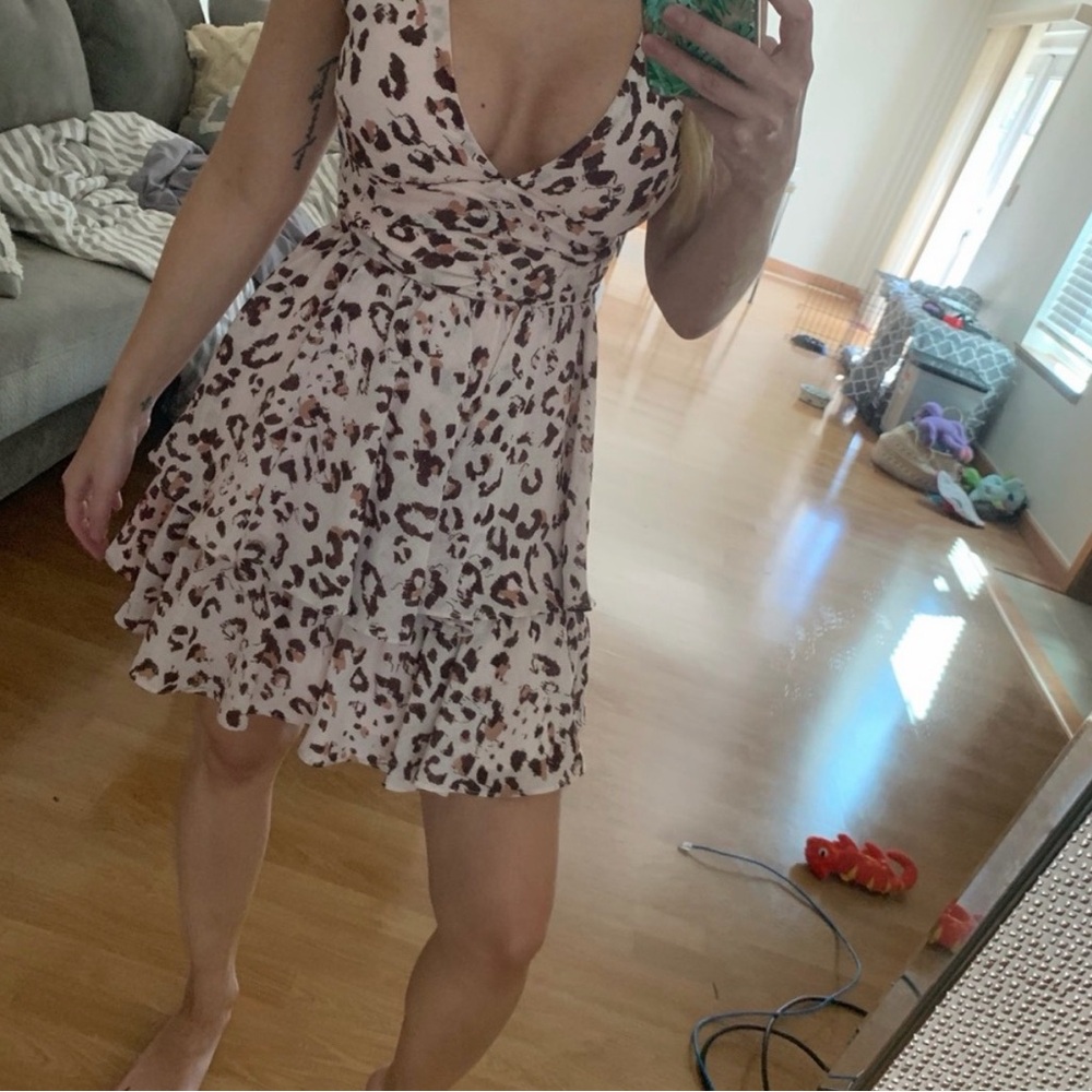 Pink leopard Vici dress size small
never worn